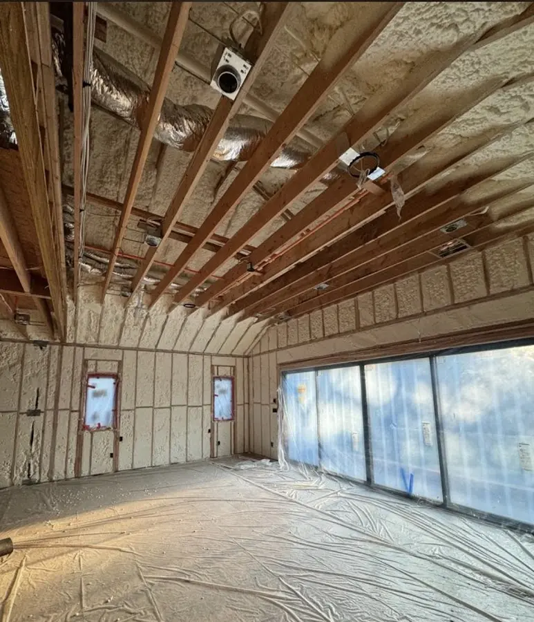 Interior walls and ceiling insulated with spray foam during new construction in Harrison